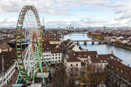 Look at boardwalk in Basel - city near Switzerland, Germany and France, look from  cathedrals tower towards russian wheel over the river Rhine