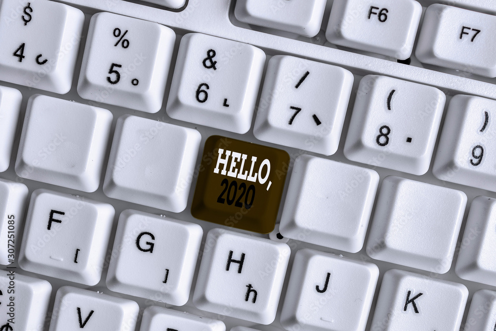 Word writing text Hello 2020. Business photo showcasing expression or gesture of greeting answering the telephone White pc keyboard with empty note paper above white background key copy space Word writing text Hello 2020. Business photo showcasing expression or gesture of greeting answering the telephone White pc keyboard with empty note paper above white background key copy space