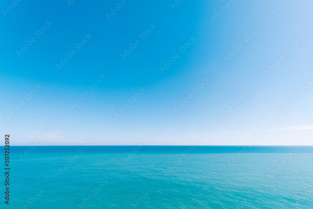 Seascape with sea horizon. Blue background