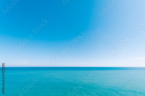 Seascape with sea horizon. Blue background