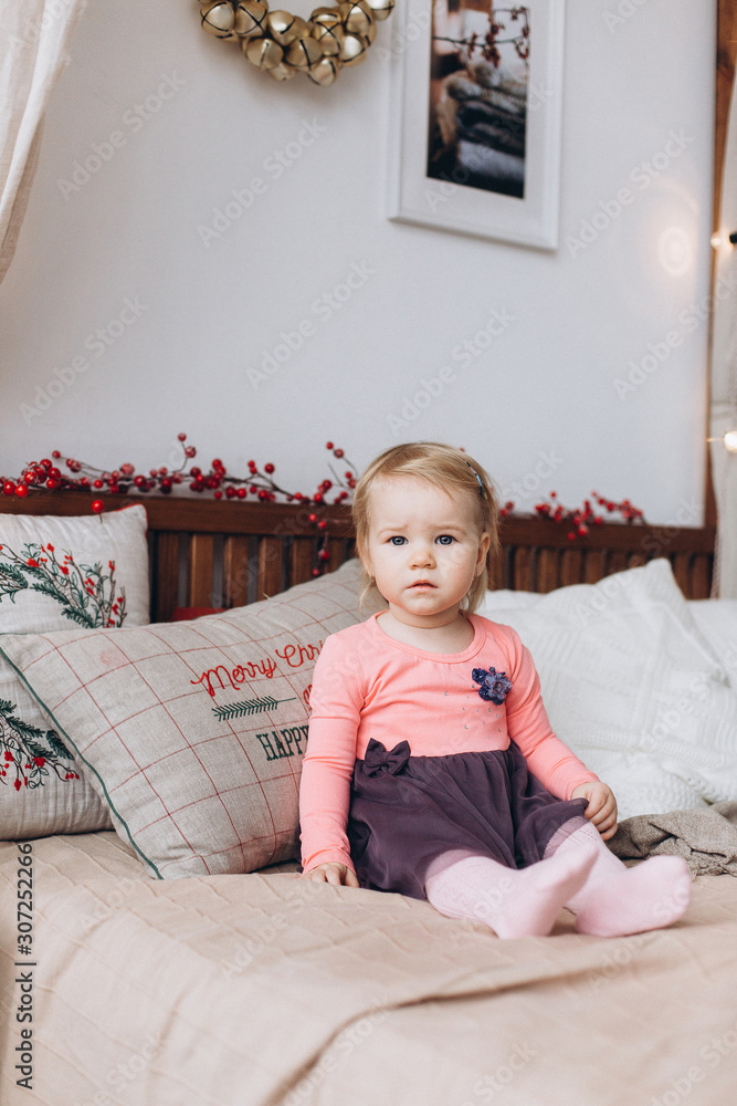 Fototapeta premium Infant adorable little cute girl playing at home in christmas morning