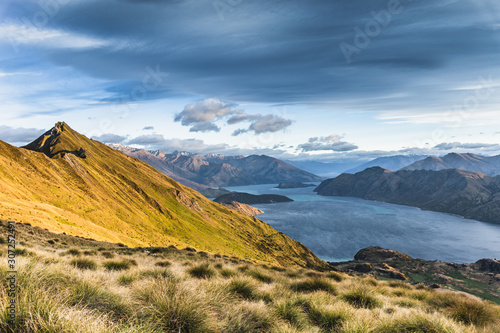 New Zealand Landscape. Lake View From Mountain Peak. Roys Peak Wanaka South Island NZ. Popular Travel Tourism Destination. photo