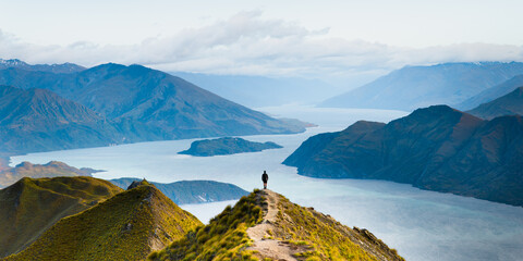 Roys peak mountain hike in Wanaka New Zealand. Popular tourism travel destination. Concept for hiking travel and adventure. New Zealand landscape background.