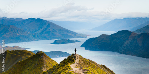 Roys peak mountain hike in Wanaka New Zealand. Popular tourism travel destination. Concept for hiking travel and adventure. New Zealand landscape background.