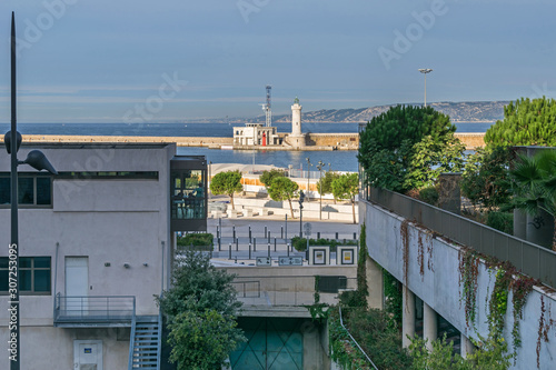 Avenue Vaudoyer and the entrance to the Old Port with the lighthouse Saint Marie  in Marseille, France photo