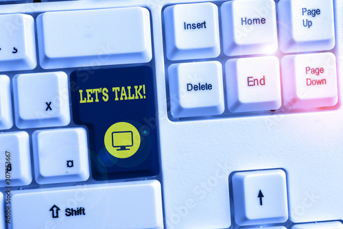 Conceptual hand writing showing Let S Talk. Concept meaning they are suggesting beginning conversation on specific topic White pc keyboard with note paper above the white background photo