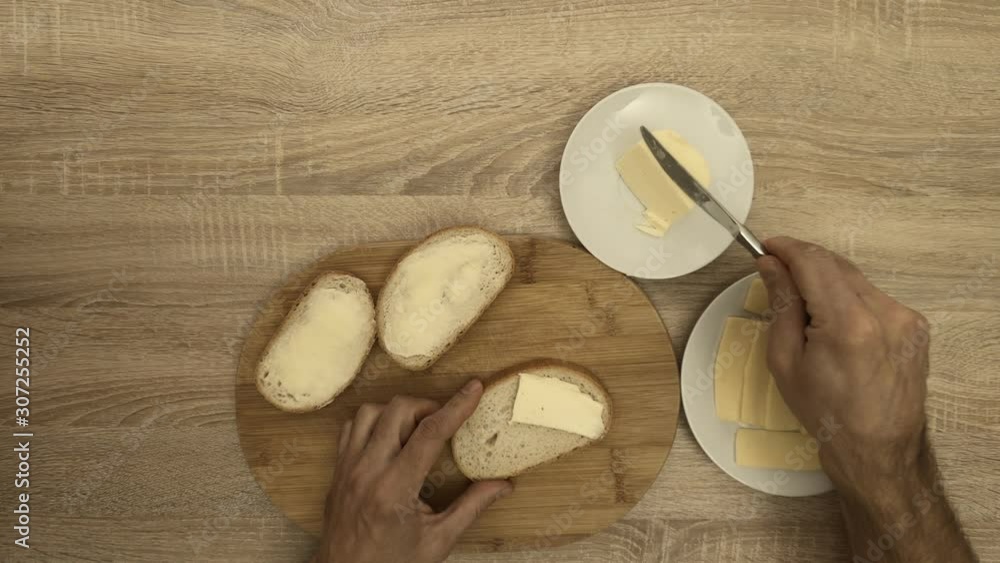 Chef making sandwich with butter and cheese Chef making sandwich with butter and cheese