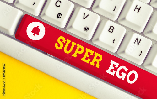 Text sign showing Super Ego. Business photo showcasing The I or self of any demonstrating that is empowering his whole soul White pc keyboard with empty note paper above white background key copy photo