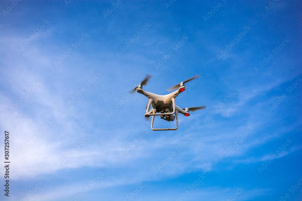 quadrocopter with digital camera at sunset. quadrocopter with digital camera at sunset.