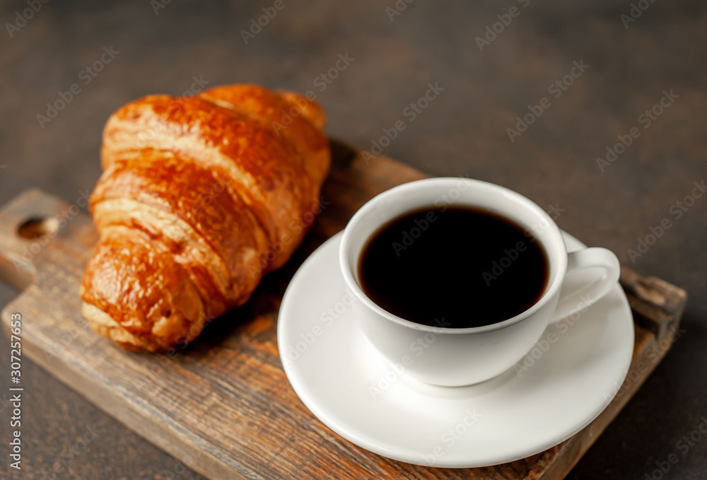 coffee and croissant on a stone table with copy space for your text, early breakfast concept coffee and croissant on a stone table with copy space for your text, early breakfast concept