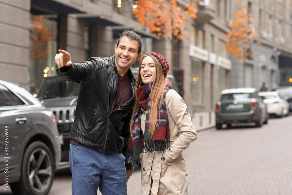 Happy couple walking in autumn city Happy couple walking in autumn city