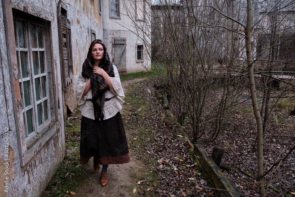 Full-length girl on a medieval street with old houses in autumn Europe, copy space. Full-length girl on a medieval street with old houses in autumn Europe, copy space.