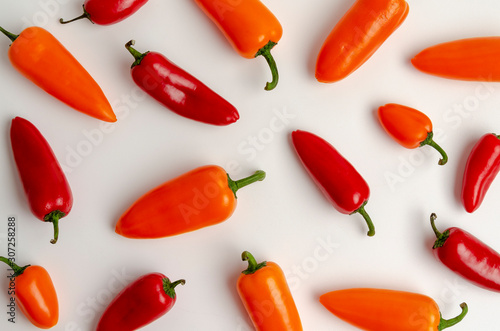 Red and orange peppers isolated on white background