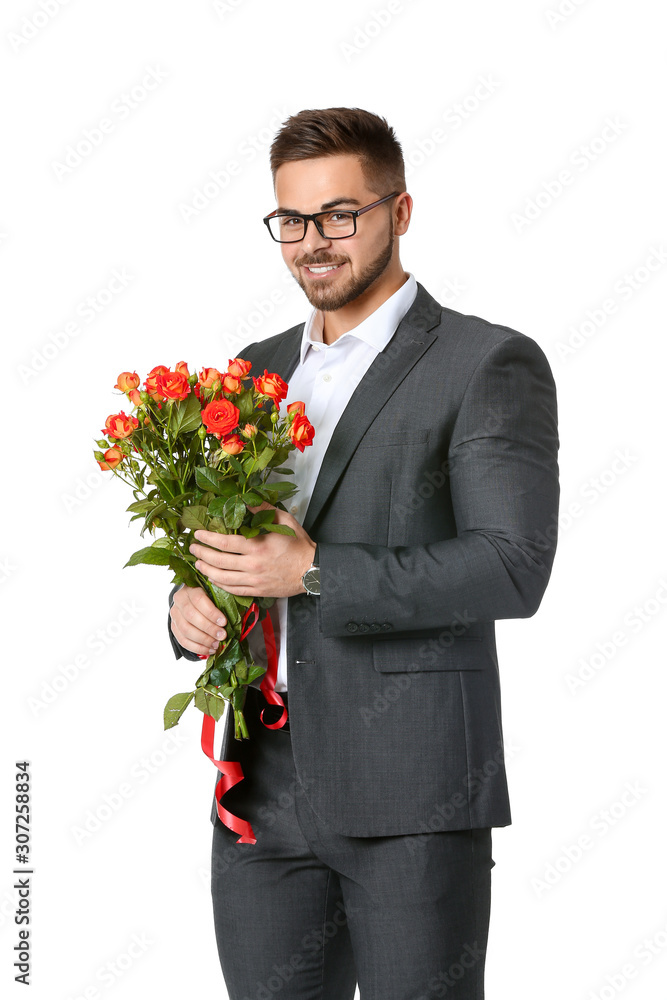 Handsome man with flowers on white background. Valentine's Day celebration Handsome man with flowers on white background. Valentine's Day celebration