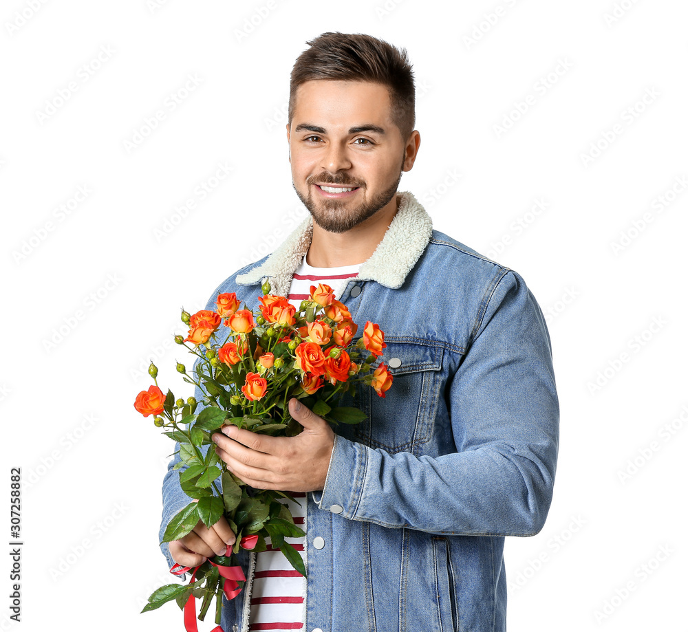 Handsome man with flowers on white background. Valentine's Day celebration Handsome man with flowers on white background. Valentine's Day celebration