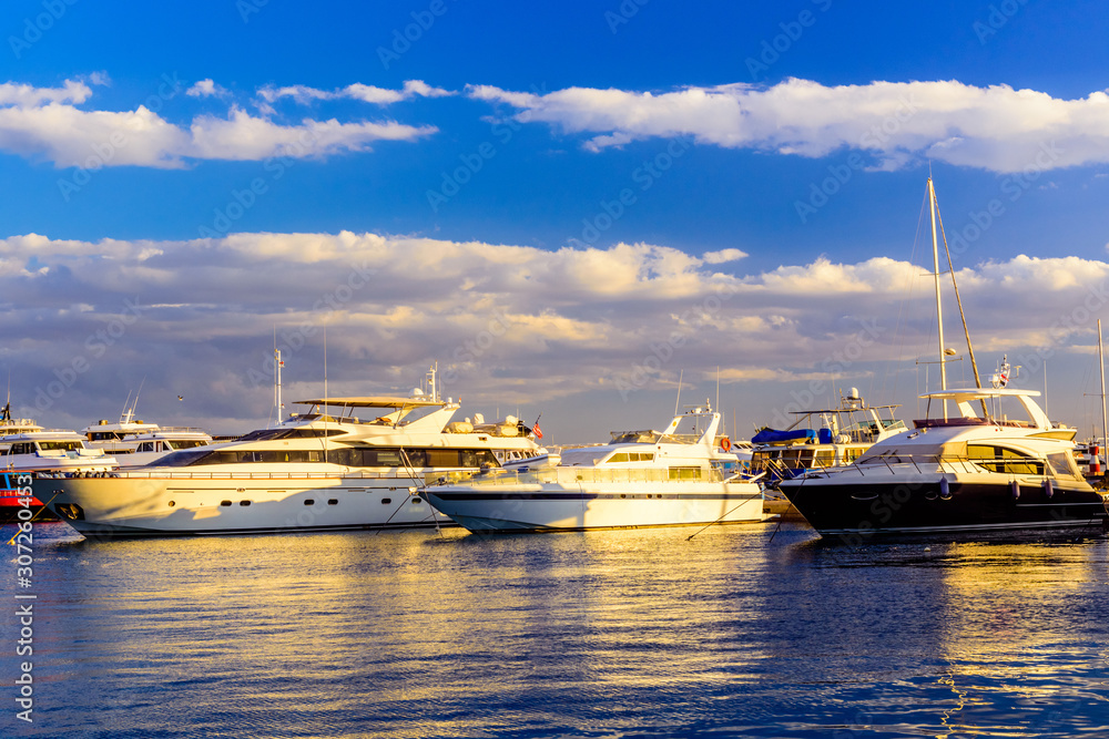White luxury yachts in a sea harbor of Hurghada, Egypt. Marina with tourist boats on Red Sea