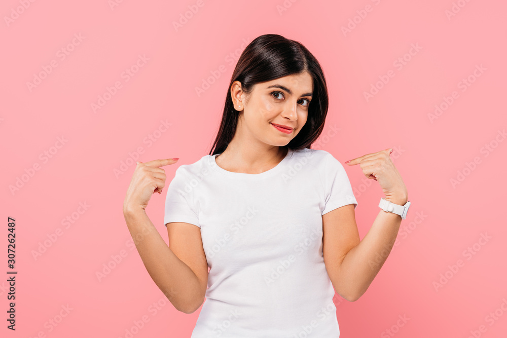 smiling pretty brunette girl pointing with fingers at herself isolated on pink smiling pretty brunette girl pointing with fingers at herself isolated on pink