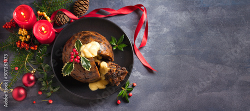 Canvas Print Christmas pudding decorated with sprig of holly
