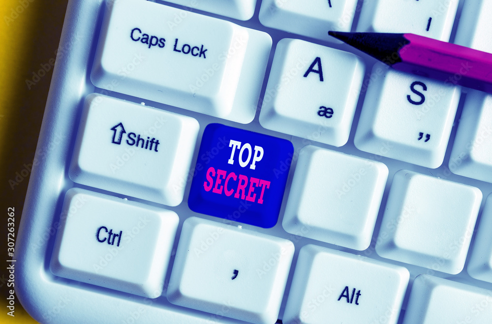 Text sign showing Top Secret. Business photo text telling someone important data or information that he cant tell White pc keyboard with empty note paper above white background key copy space Text sign showing Top Secret. Business photo text telling someone important data or information that he cant tell White pc keyboard with empty note paper above white background key copy space