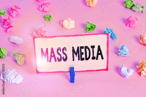 Conceptual hand writing showing Mass Media. Concept meaning Group showing making news to the public of what is happening Colored crumpled papers empty reminder pink floor clothespin © Artur