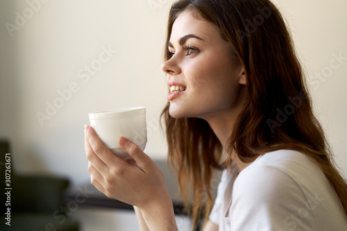 young woman with cup of coffee