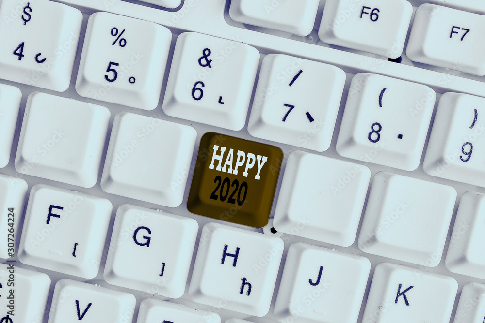 Word writing text Happy 2020. Business photo showcasing time or day at which a new calendar year begin from now White pc keyboard with empty note paper above white background key copy space Word writing text Happy 2020. Business photo showcasing time or day at which a new calendar year begin from now White pc keyboard with empty note paper above white background key copy space