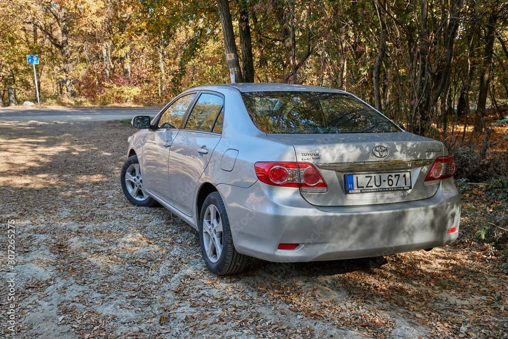 SIKFOKUT, HUNGARY - CIRCA 2019: Toyota Corolla 2011 model E15 facelift  parked in a field parking spot by the forest. Corollas are one of the best  selling cars in the world Photos | Adobe Stock