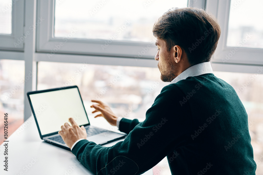 man using digital tablet on sofa at home man using digital tablet on sofa at home