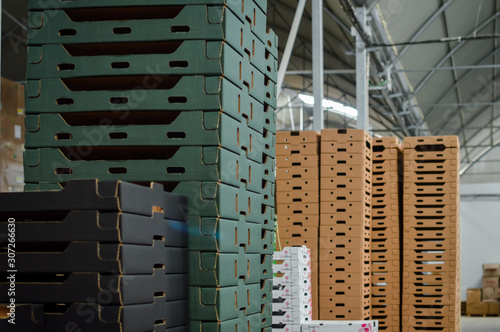 Stack of folded paper box in warehouse
