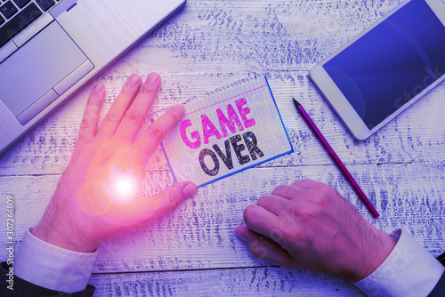 Conceptual hand writing showing Game Over. Concept meaning A situation in a particular sport that reach his finals or ending photo