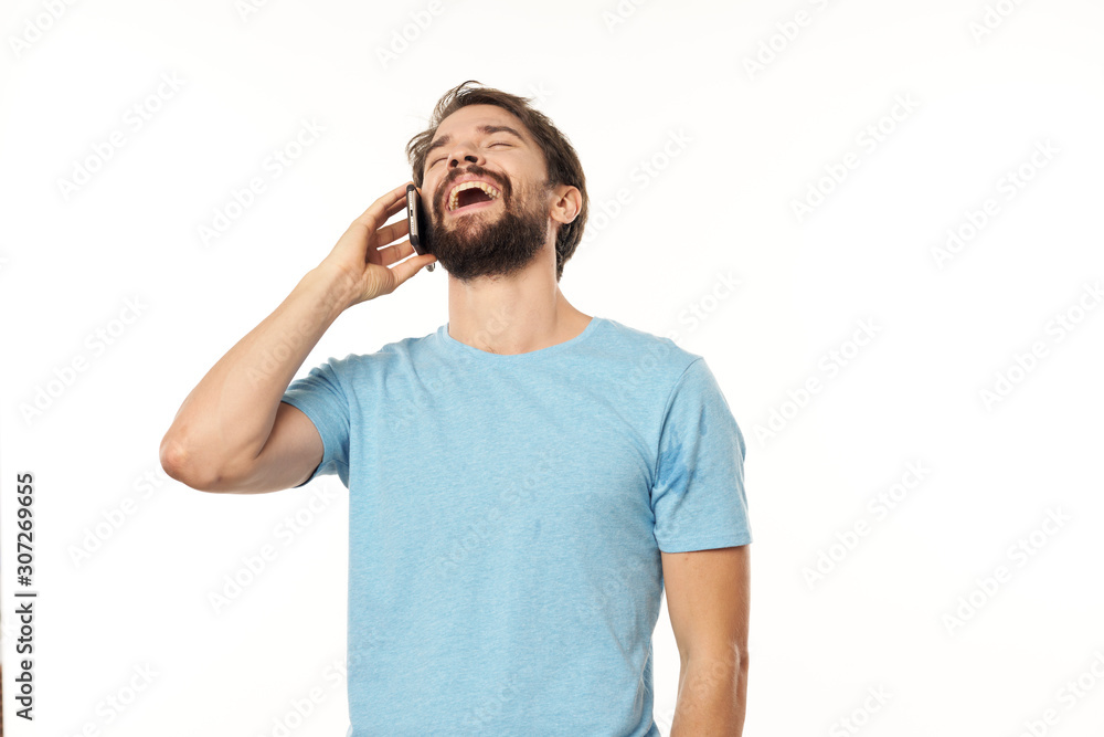 Fototapeta premium young man listening to music with headphones isolated on white