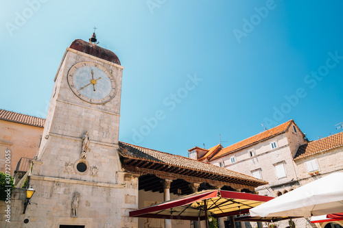 Clock tower and old town square in Trogir, Croatia photo