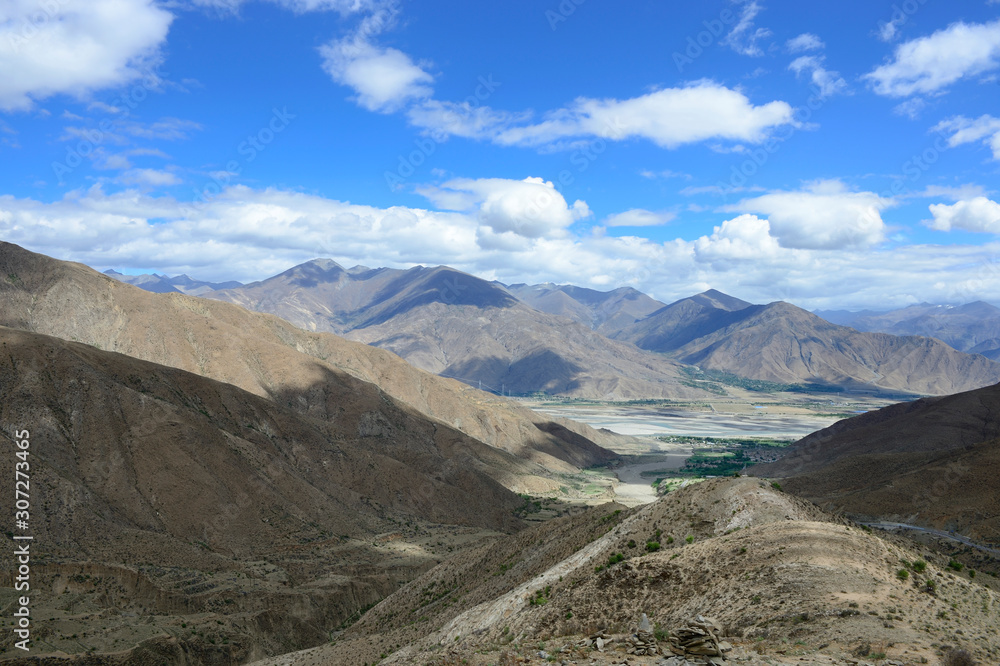 A cairn sits atop a mountain overlooking Brahmaputra Valley in Tibet Autonomous Region of China.