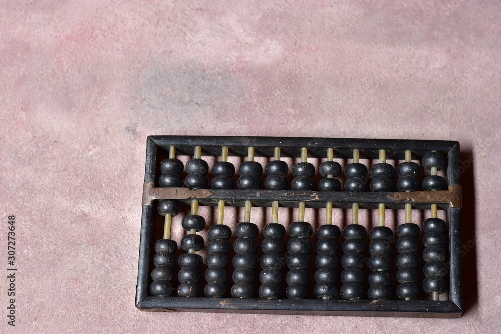 old wooden abacus isolated on pink background old wooden abacus isolated on pink background