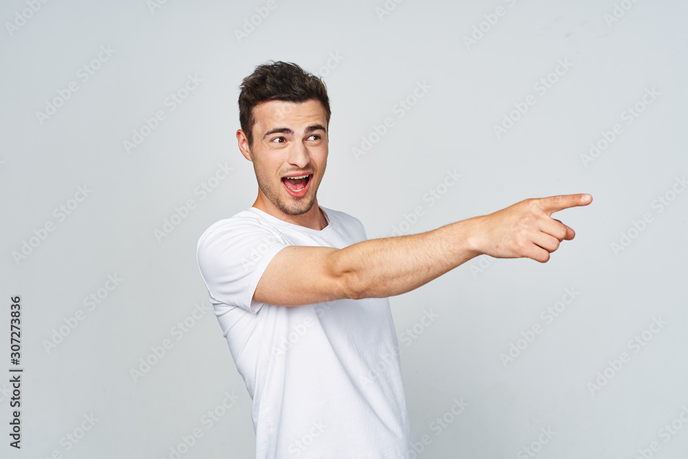 young man pointing at something interesting young man pointing at something interesting