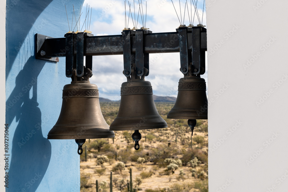 Bell tower of Elijah Chapel at Saint Anthony Greek Orthodox Monastery in Florence, Arizona. Focus on the bells.