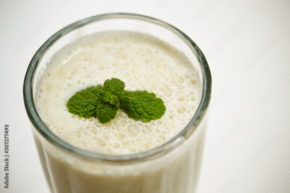Smoothie in glass with mint leaves Smoothie in glass with mint leaves