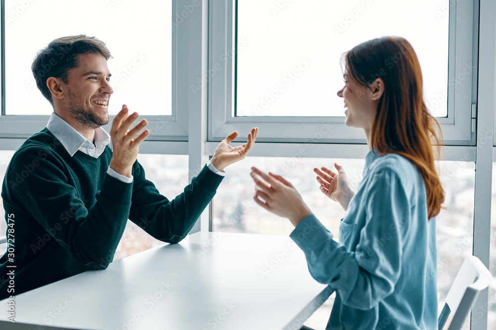 man and woman shaking hands in office man and woman shaking hands in office