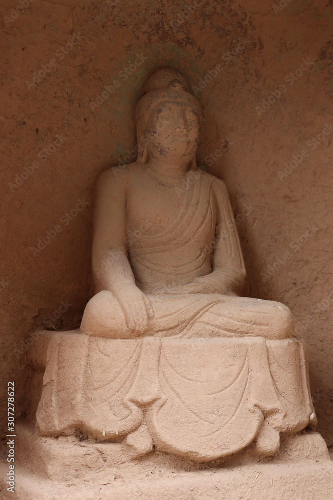 Fototapeta Buddhist sculpture in Bingling Temple and grottoes, Yongjing, Gansu Province, China.UNESCO World heritage site.(Silk Roads: the Routes Network of Chang'an-Tianshan Corridor)