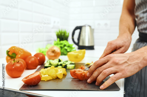 woman cutting vegetables in the kitchen