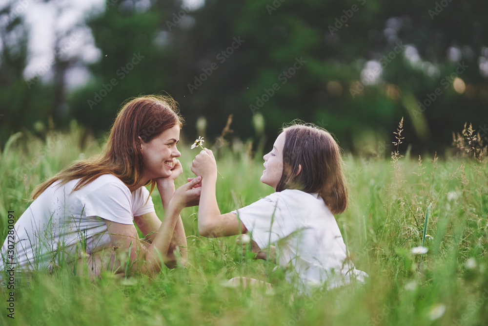 mother and daughter in the park mother and daughter in the park