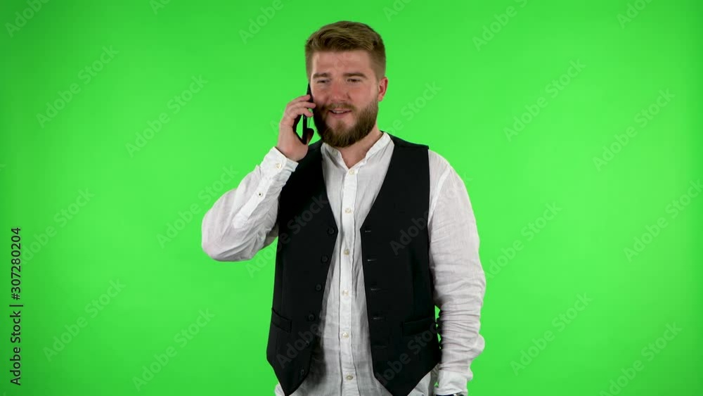 Man talking for mobile phone and rejoice. Green screen Man talking for mobile phone and rejoice. Green screen