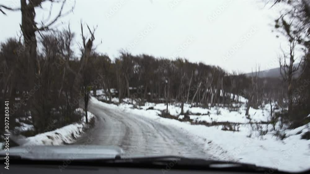 View From Car Interior Into Snowy Road in Tierra del Fuego, near Ushuaia, Argentina. View From Car Interior Into Snowy Road in Tierra del Fuego, near Ushuaia, Argentina.