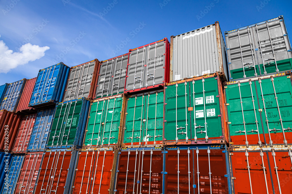 Fototapeta premium The national flag of Bulgaria on a large number of metal containers for storing goods stacked in rows on top of each other. Conception of storage of goods by importers, exporters