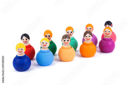 Close-up of a children's toy made of natural wood in the form of little people of different colors with a smile on a white isolated background. 
