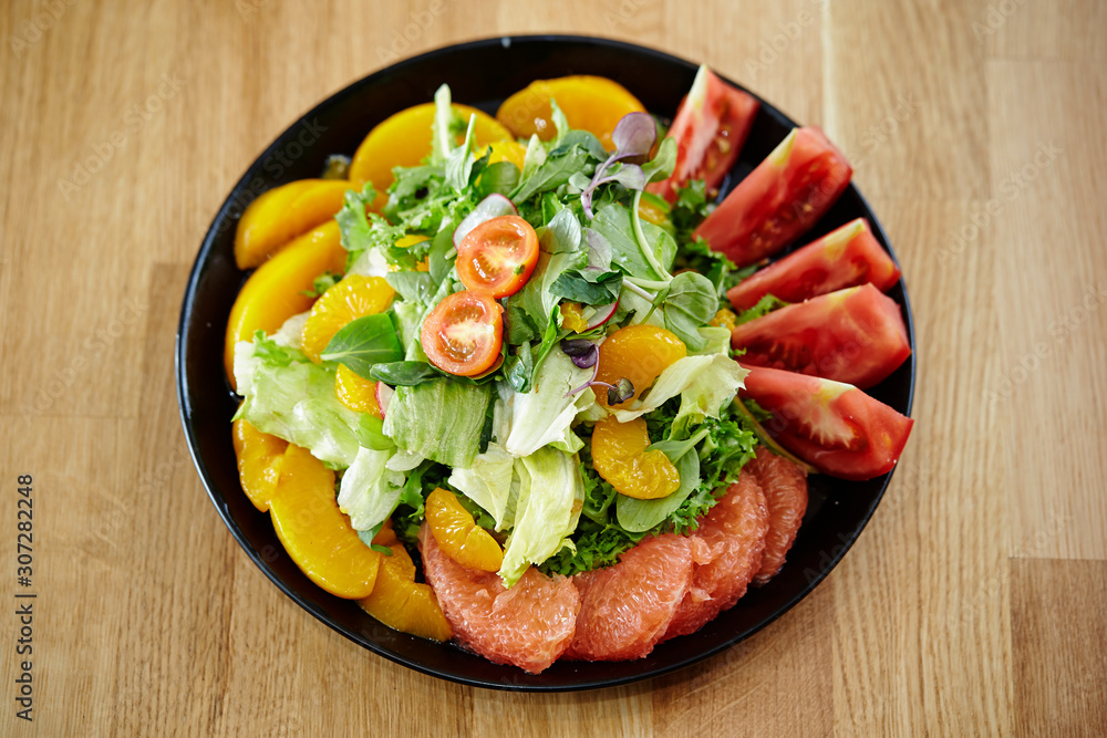 Fruits salad, peach, tangerine and pink grapefruit 