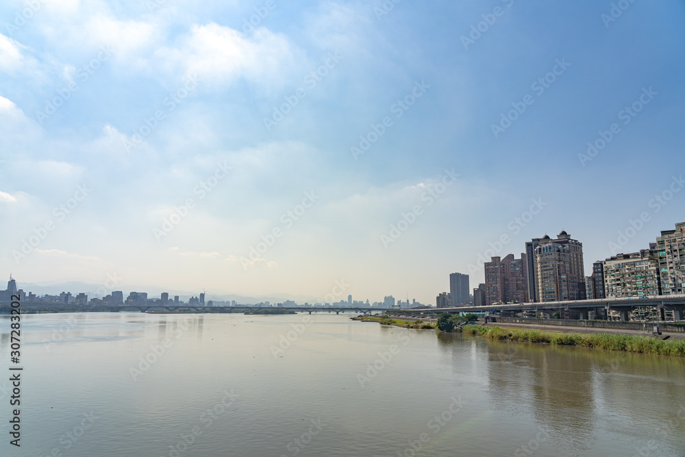 Scenery of Tamsui river bank, view on Taipei bridge, a bridge link New Taipei City to Taipei city, Taiwan Scenery of Tamsui river bank, view on Taipei bridge, a bridge link New Taipei City to Taipei city, Taiwan