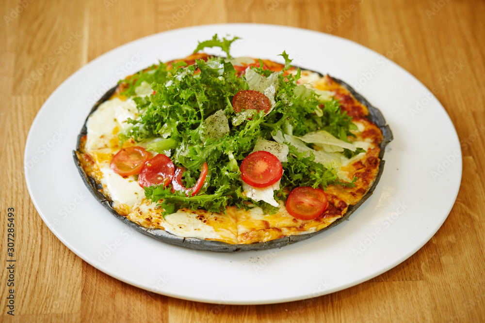 Black dough salad pizza with black pepper Black dough salad pizza with black pepper