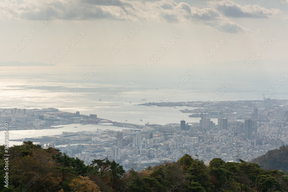 Afternoon view of Kobe cityscape with port under fog. the view from Rokko mountain Kobe, Japan. Afternoon view of Kobe cityscape with port under fog. the view from Rokko mountain Kobe, Japan.