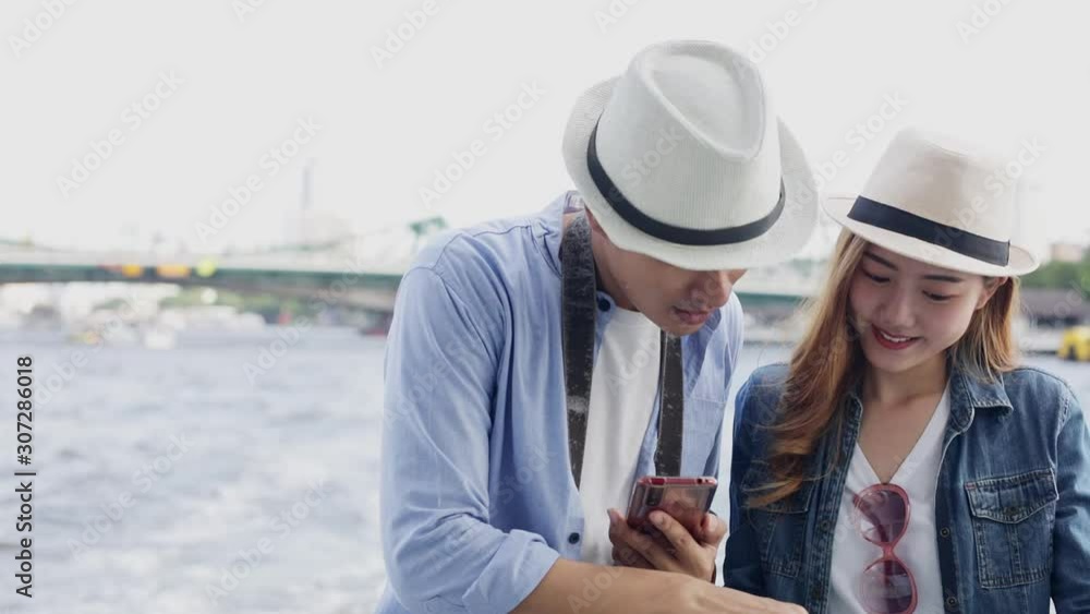 Traveler Asian couple travel in Bangkok, Thailand, sweet couple taking photo spending holiday trip .Lifestyle couple travel in temple concept.Young fun happy Asian tourist backpacker travel. Traveler Asian couple travel in Bangkok, Thailand, sweet couple taking photo spending holiday trip .Lifestyle couple travel in temple concept.Young fun happy Asian tourist backpacker travel.